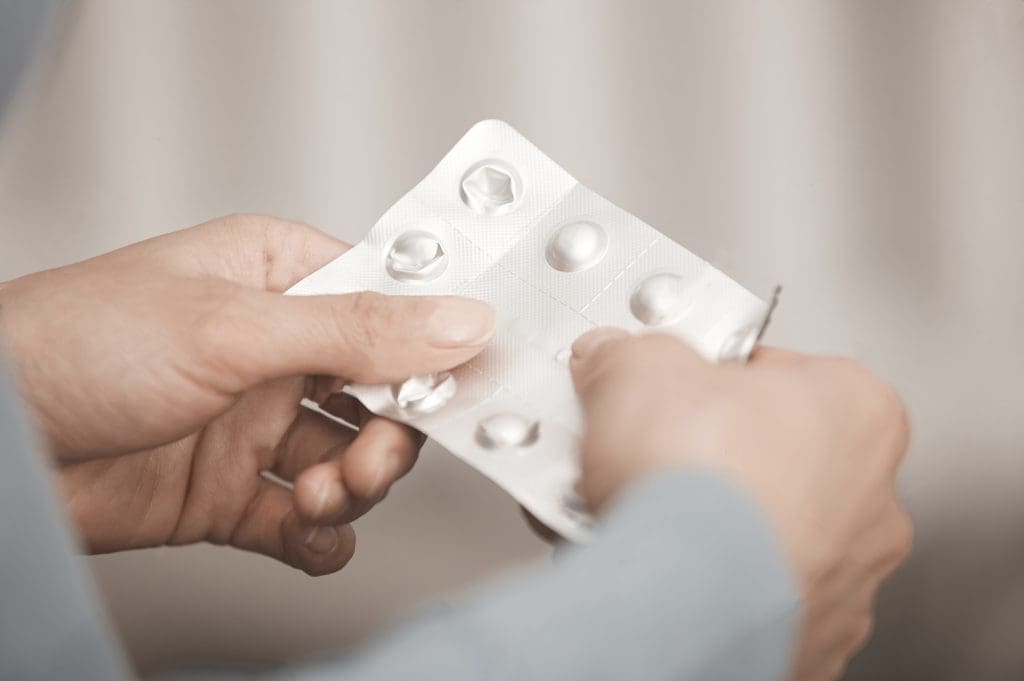 hands-of-woman-holding-opioids-1024x681.jpg